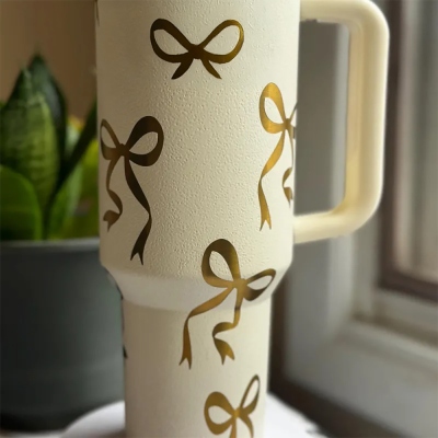 40 oz Bow Themed Laser Engraved Custom Tumbler - Elegant cup. Fancy. Personalized. Coquette. Gold bow drinkware. Generic bow cup.