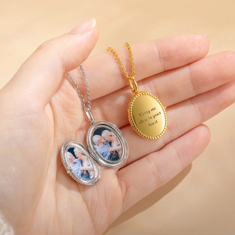 gold oval locket with photoes